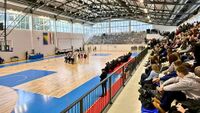 Sportshall with People sitting on the grandstand